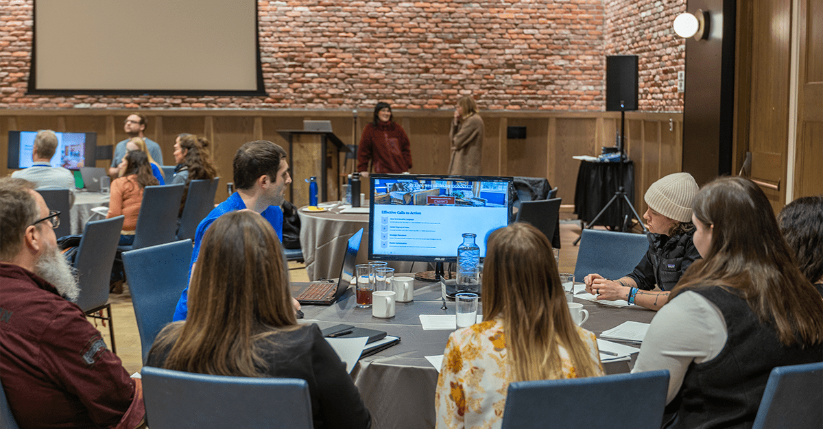 Attendees participate in a round table discussion during the 2025 rezStream Customer Success Conference, with a focus on effective calls to action and digital strategy.