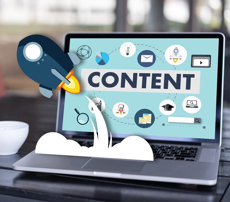 Image of a laptop with "CONTENT" on the screen and an animated rocket ship launching from the laptop.